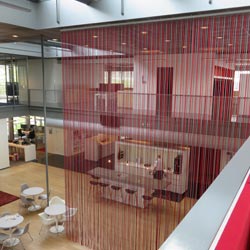 Rope curtain as room divider - red ropes 